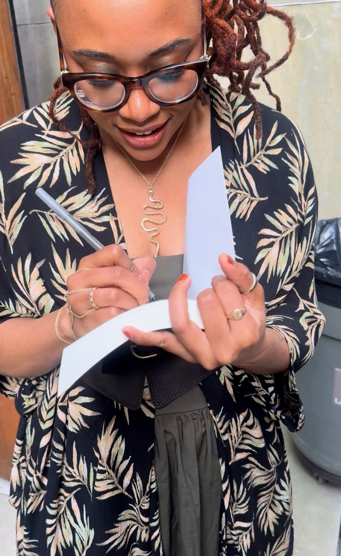 Nadia signing copies for fans