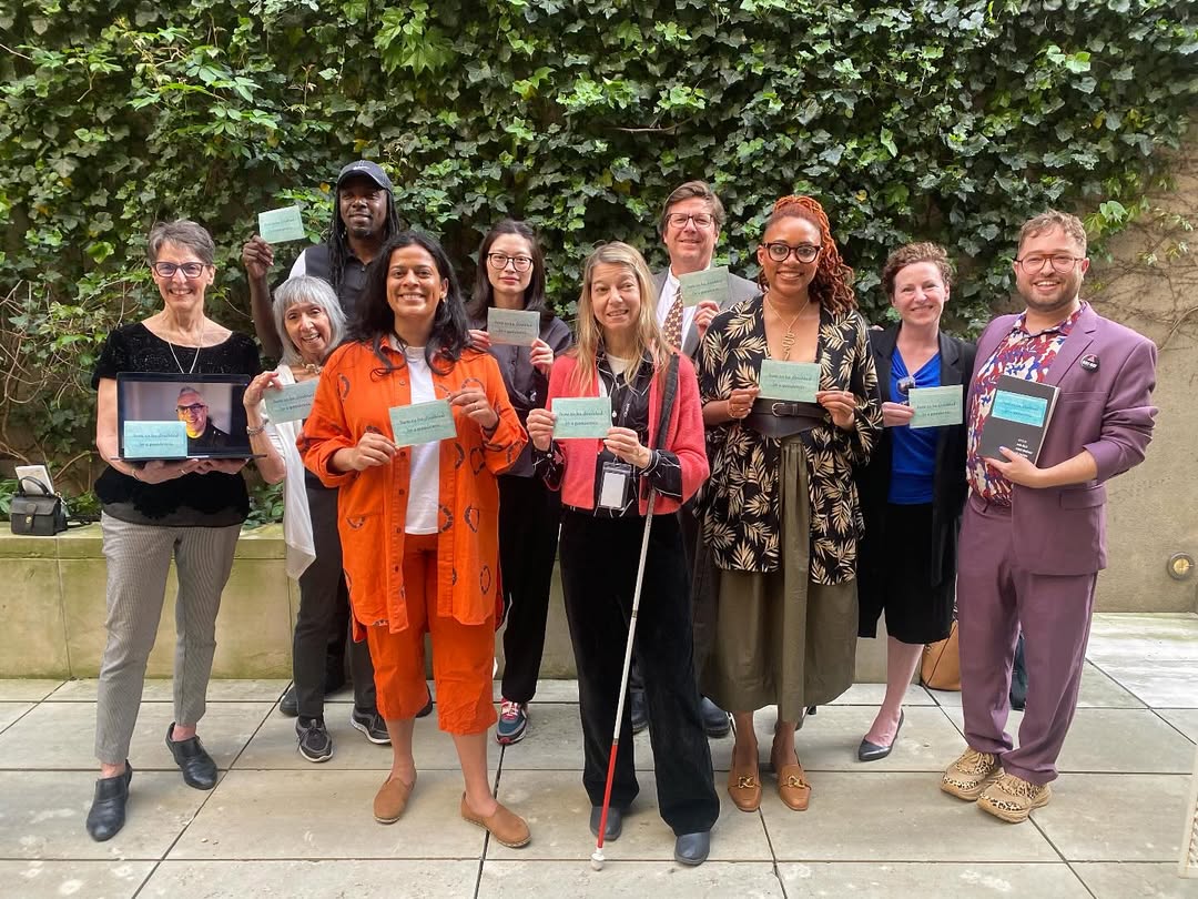 A group photo at the book party of some of the editors and author of the anthology How To Be Disabled in a Pandemic.