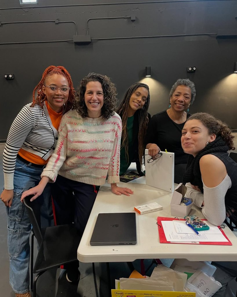 Nadia, Melissa, Sandie, Jan, and Calypso seated together during a work session at Tiffany Street Theater in Hunts Point, where Axes, Herbs, and Satchels premiered in May 2025.”